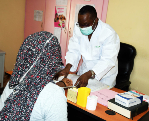 A doctor in Burkina Faso performing a blood test on a patient