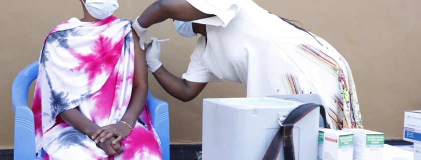 A woman receiving a COVID-19 vaccine. Photo credit: USAID/PEPFAR