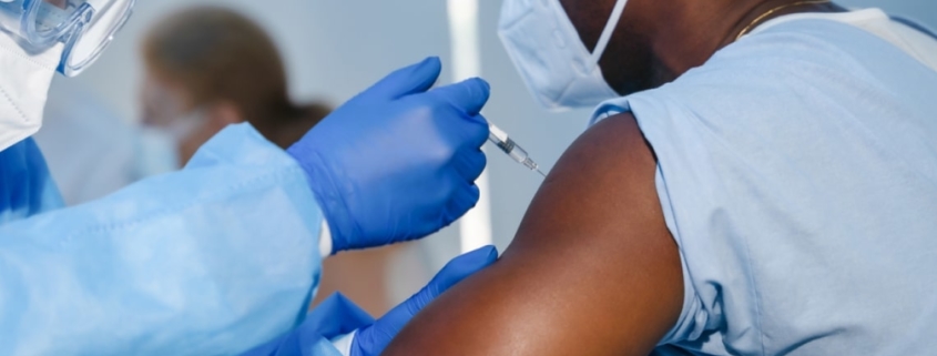 A healthcare worker administering the COVID-19 vaccine. Credit: Mongkolchon Akesin/Shutterstock