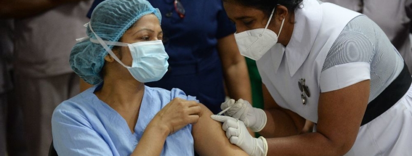 A healthcare worker administering a vaccine