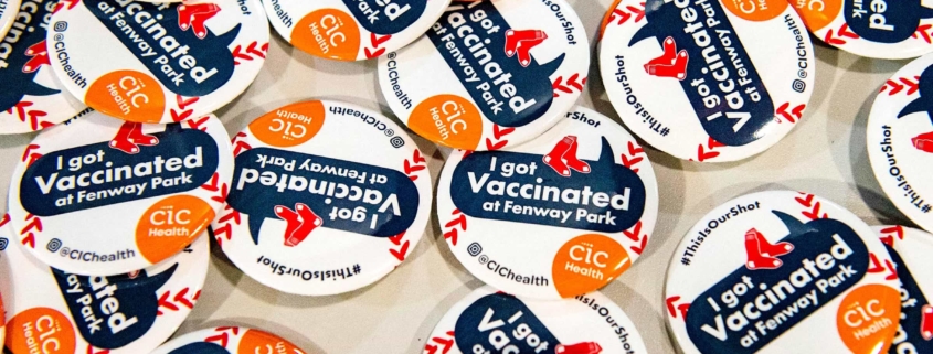 Stickers that say "I got vaccinated at Fenway Park!" Photo credit: Getty Images