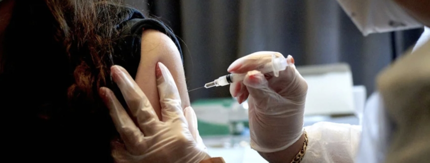A health-care worker administers a dose of the Moderna coronavirus vaccine in New York in April. Photo Credit: Gabby Jones/Bloomberg News