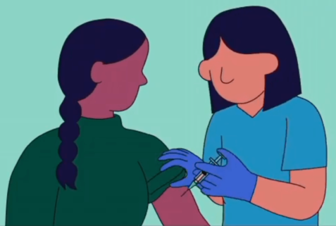 a healthcare worker administering a vaccine