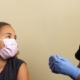 A teenager receiving a vaccine
