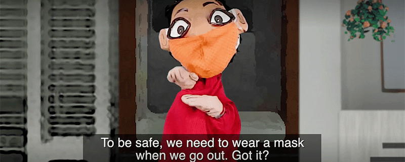 A hand puppet wearing a face mask explaining the importance of wearing a mask