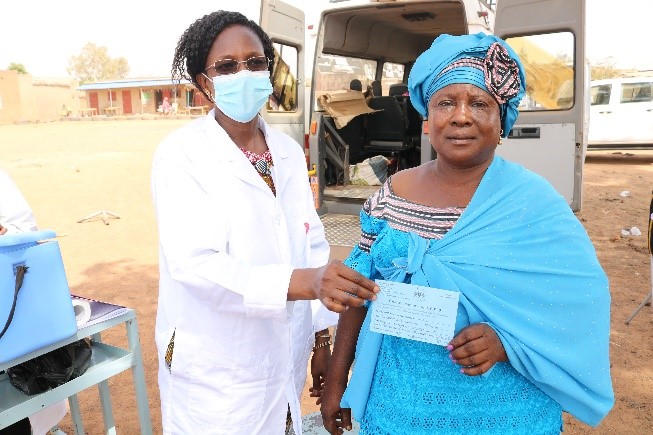 Two Burkina Faso woman holding a vaccination card
