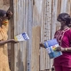 Nigerian community health worker explaining COVID-19 prevention measures to another woman. Photo: Nigeria Centre for Disease Control