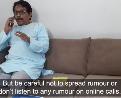 A man in Bangladesh saying on the phone: "But be careful not to spread rumor or don't listen to any rumor on online calls."