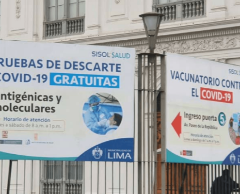 Posters along a main street in Lima, Peru, advertising free access to COVID-19 tests (photo taken July 2022)