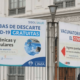 Posters along a main street in Lima, Peru, advertising free access to COVID-19 tests (photo taken July 2022)