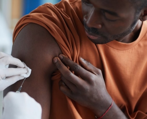 Man receiving COVID vaccine