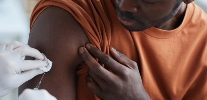 Man receiving COVID vaccine