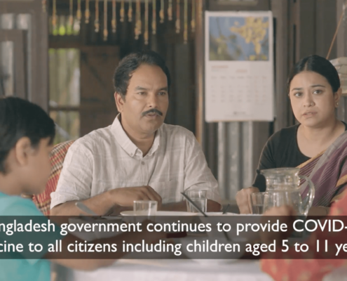 A Bangla family sitting at a table. The text reads: "Bangladesh government continues to provide COVID-19 vaccine [sic] to all citizens including children aged 5 to 11 years."